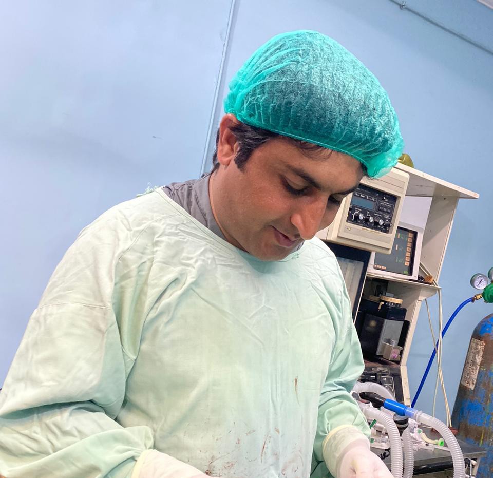 Dr. Abdul Malik performing his surgical procedure